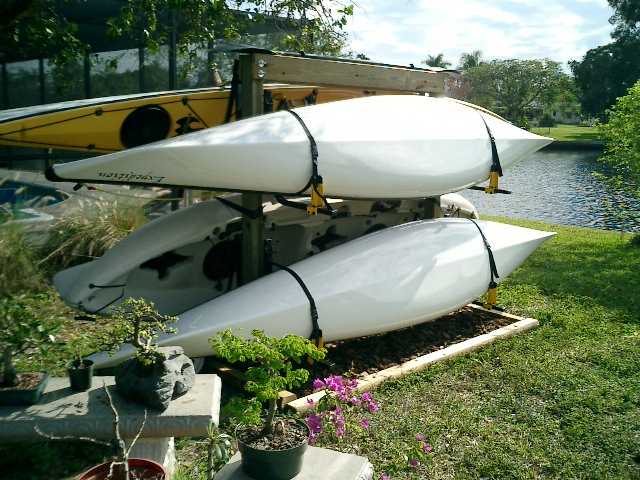 Wall Mounts on wooden posts in a mulched garden